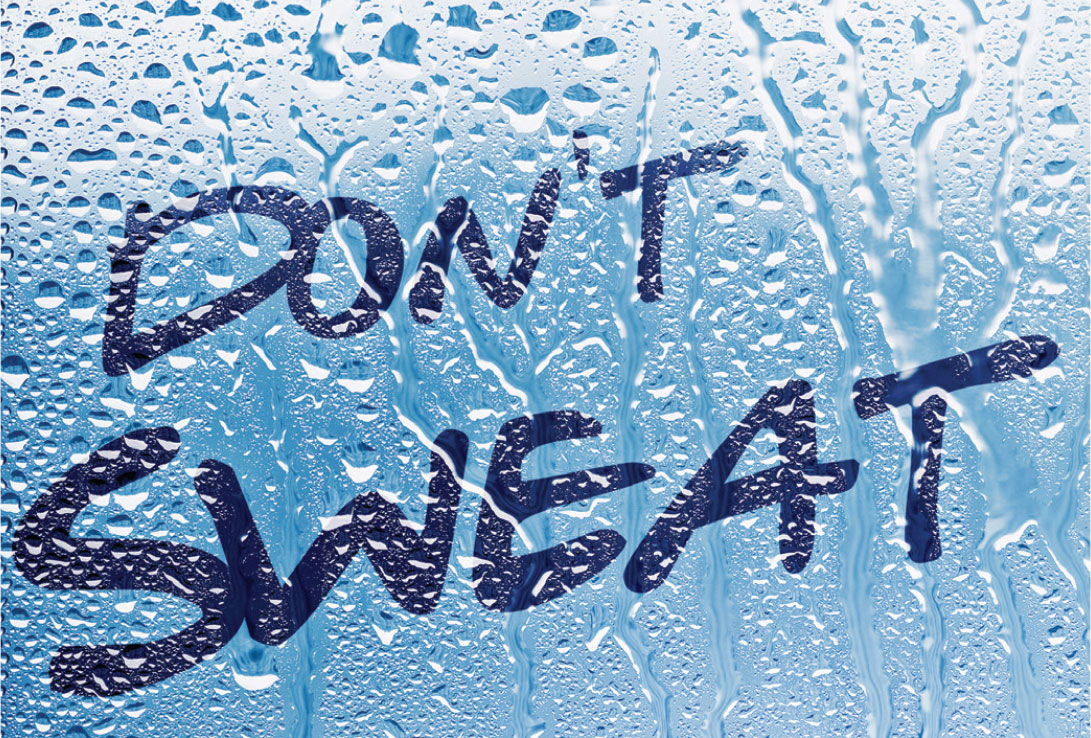 The words “Don’t Sweat It” on a blue surface covered in water droplets.