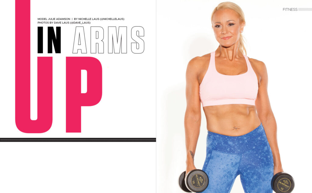 Woman holding dumbbells at her sides beside the heading Up in Arms.