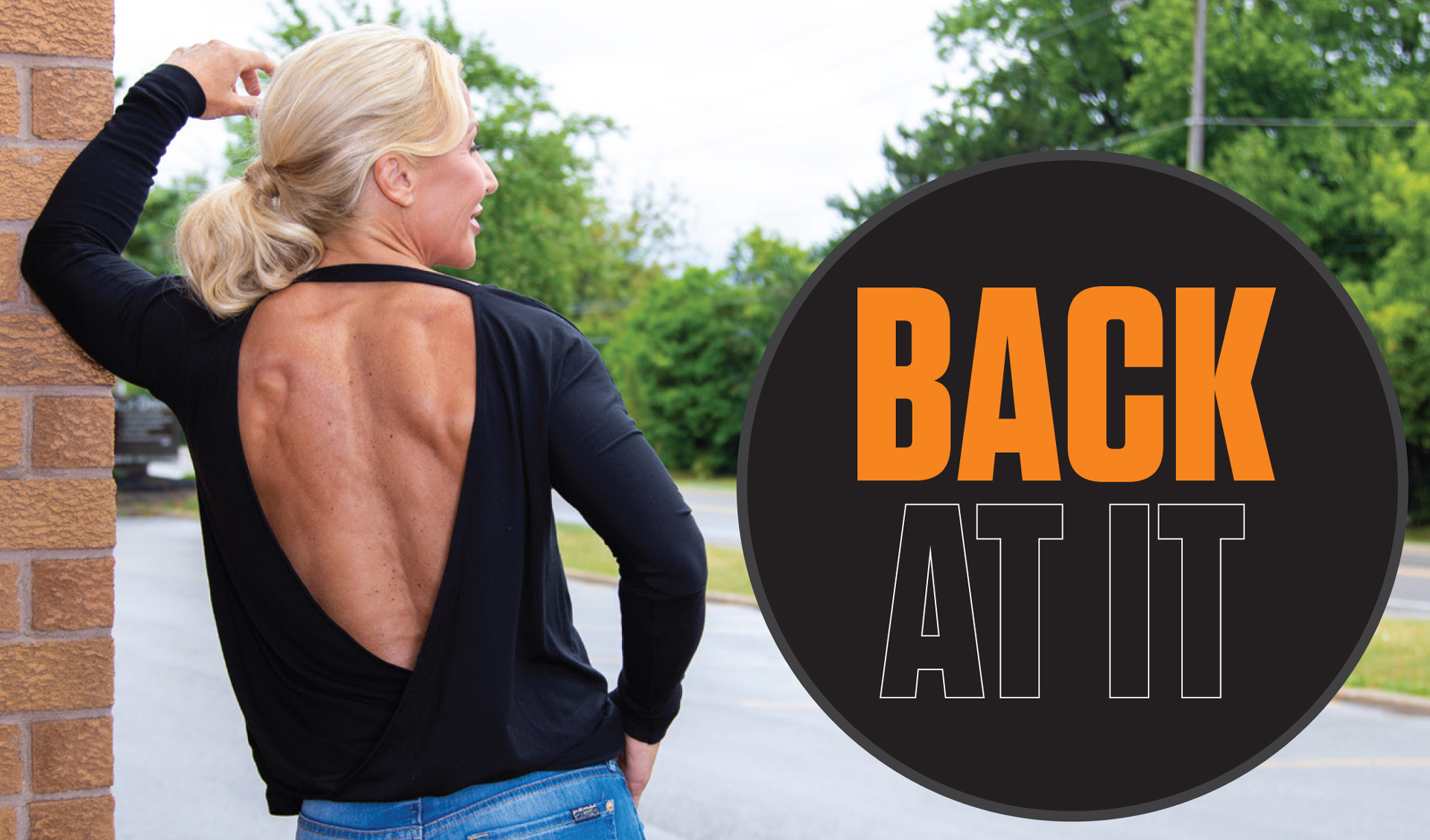 Woman in an open-back black top flexing one arm outdoors beside the heading Back at It.