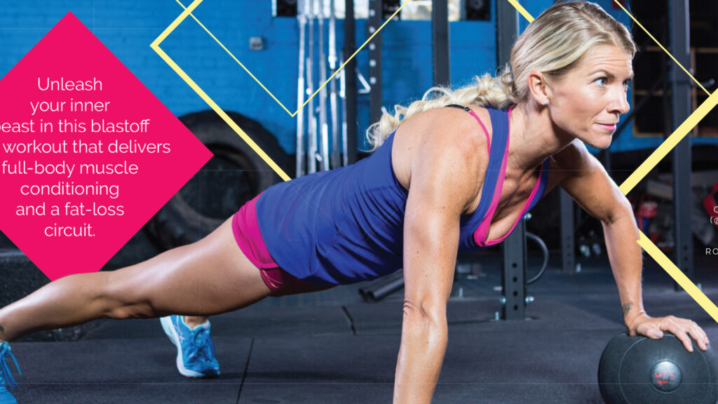 Woman in workout clothes doing a plank exercise with one hand on a medicine ball in a gym setting.