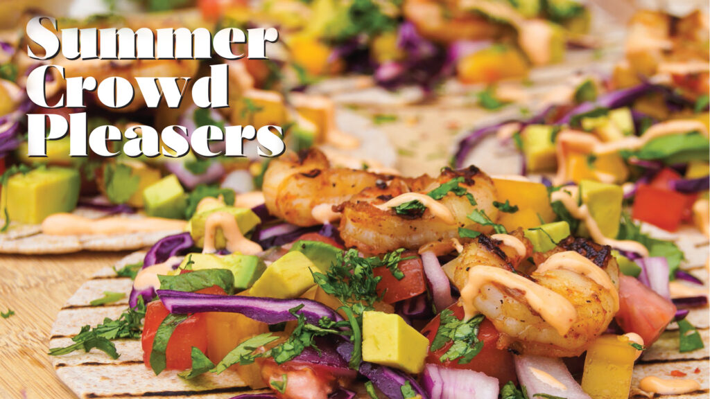 Grilled shrimp and colourful vegetable wraps beneath the heading Summer Crowd Pleasers.