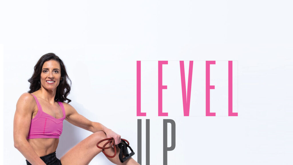Woman in a pink sports bra beside the heading “Level Up”.