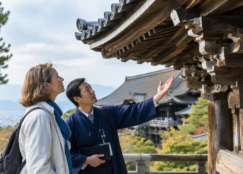 Woman learning about Kyoto temple architecture with a local guide.